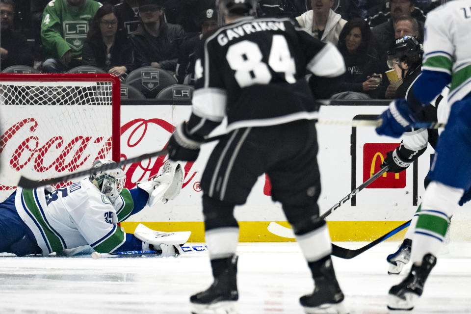 Vancouver Canucks goaltender Thatcher Demko (35) dives to catch the puck during the third period of the team's NHL hockey game against the Los Angeles Kings, Tuesday, March 5, 2024, in Los Angeles. (AP Photo/Kyusung Gong)