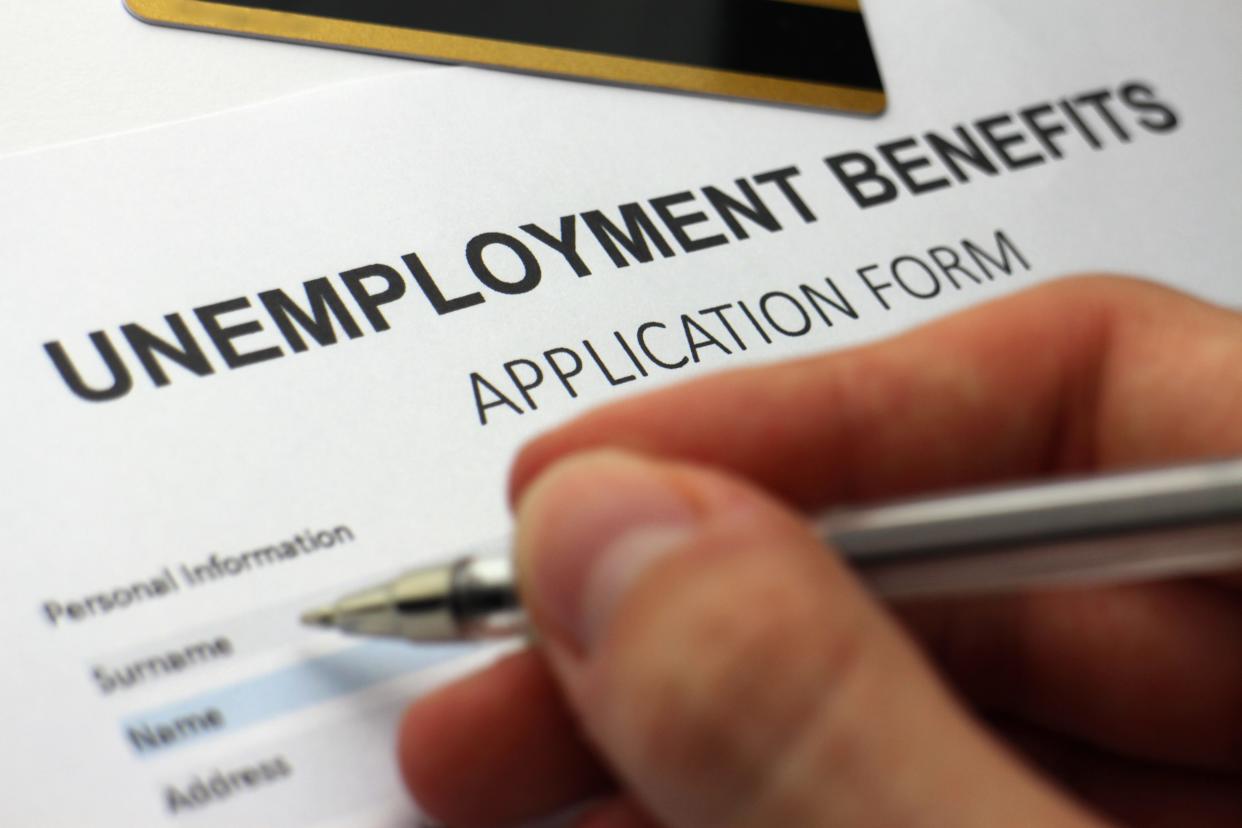 A woman tasked with reviewing unemployment claims was receiving benefits herself.