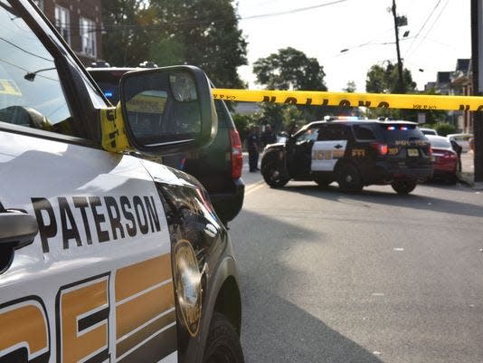 Paterson Police cars are pictured.