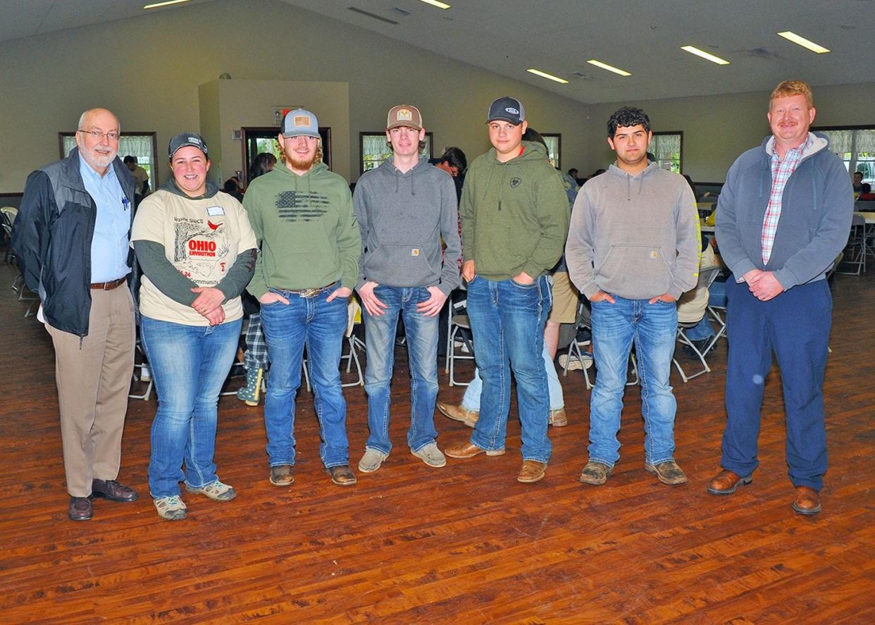 Wayne County Commissioners Ron Amstutz, left, and Jonathan Hofstetter, far right, visited the Envirothon competition held at the Kidron Community Park and posed with members of the Norwayne FFA team, who participated in the event for the first time. Members were Adviser Catie Noyes-Johnson, team captain Zavier Wenninger, Caleb Haynes, Caleb Stoller and Carson Rupp.