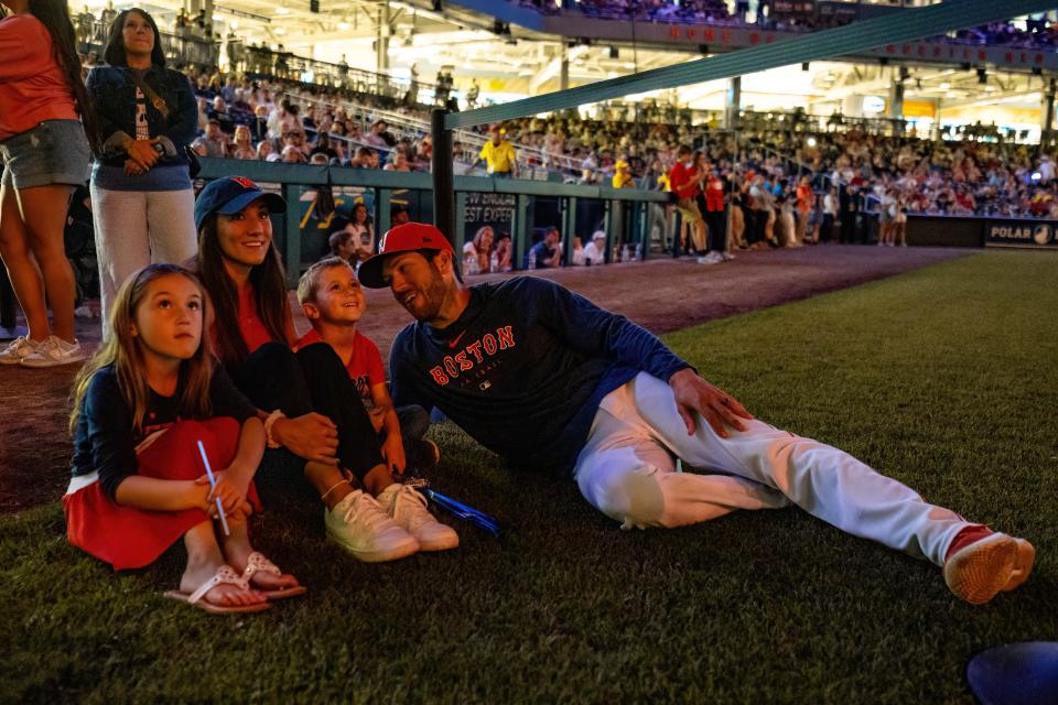 Worcester Red Sox manager Chad Tracy (right) enjoys fireworks at Polar Park with his two kids, Avery and Austin, and wife, Emily, on June 23, 2023.