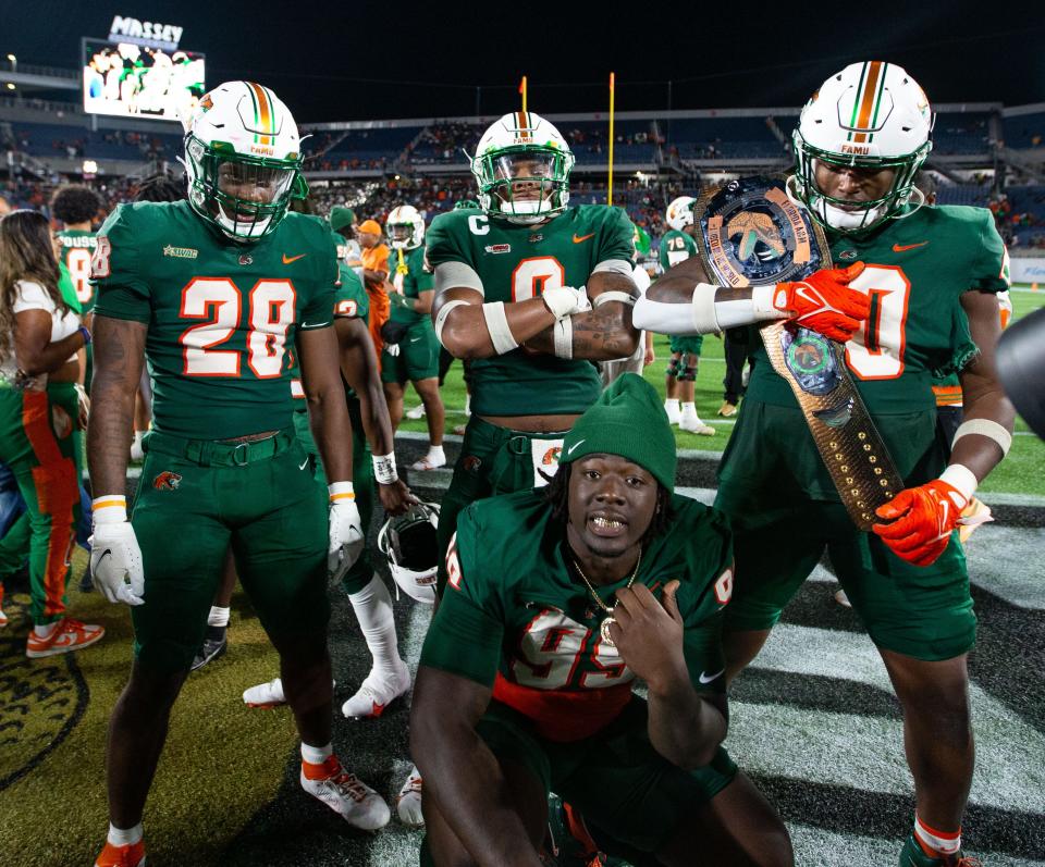 Florida A&M Rattlers celebrate the team’s victory over Bethune Cookman Wildcats in the Florida Classic at Camping World Stadium on Saturday, Nov. 18, 2023. James Ash is pictured at the lower center, wearing No. 99.