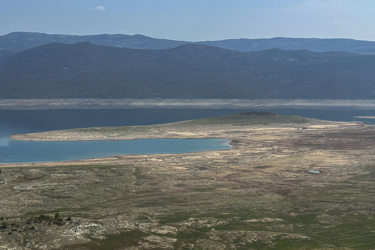 The dried out Bileca lake, near the town of Bileca, Bosnia, Thursday, Sept. 5, 2024. Experts say the summer of 2024 in the Balkans was the hottest since measurements started more than 130 years ago. (AP Photo/Eldar Emric)