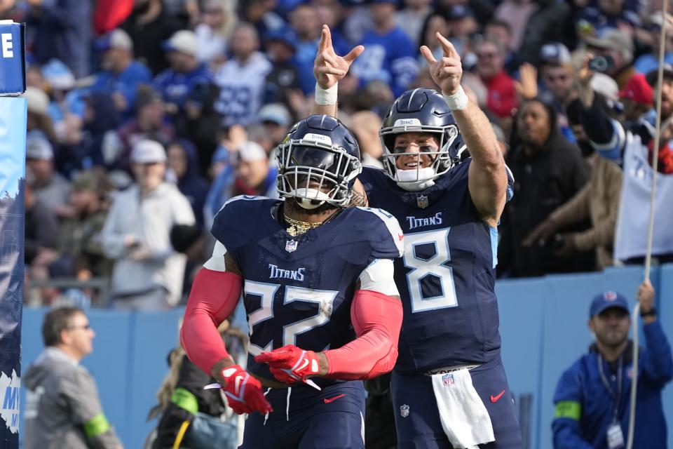 Tennessee Titans' Derrick Henry (22) celebrates with quarterback Will Levis (8) after Henry ran for a touchdown during the first half of an NFL football game against the Indianapolis Colts, Sunday, Dec. 3, 2023, in Nashville, Tenn. (AP Photo/George Walker IV)