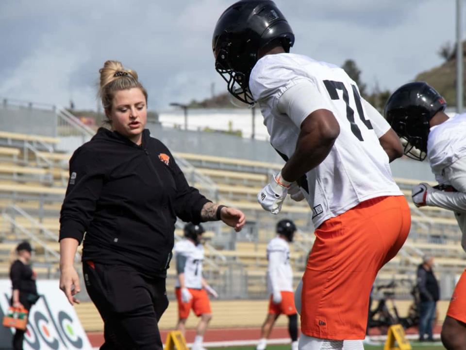 The B.C. Lions were the first CFL team to hire a female coach, in defensive assistant Tanya Walter, left. (Lyndsay Duncombe/CBC - image credit)