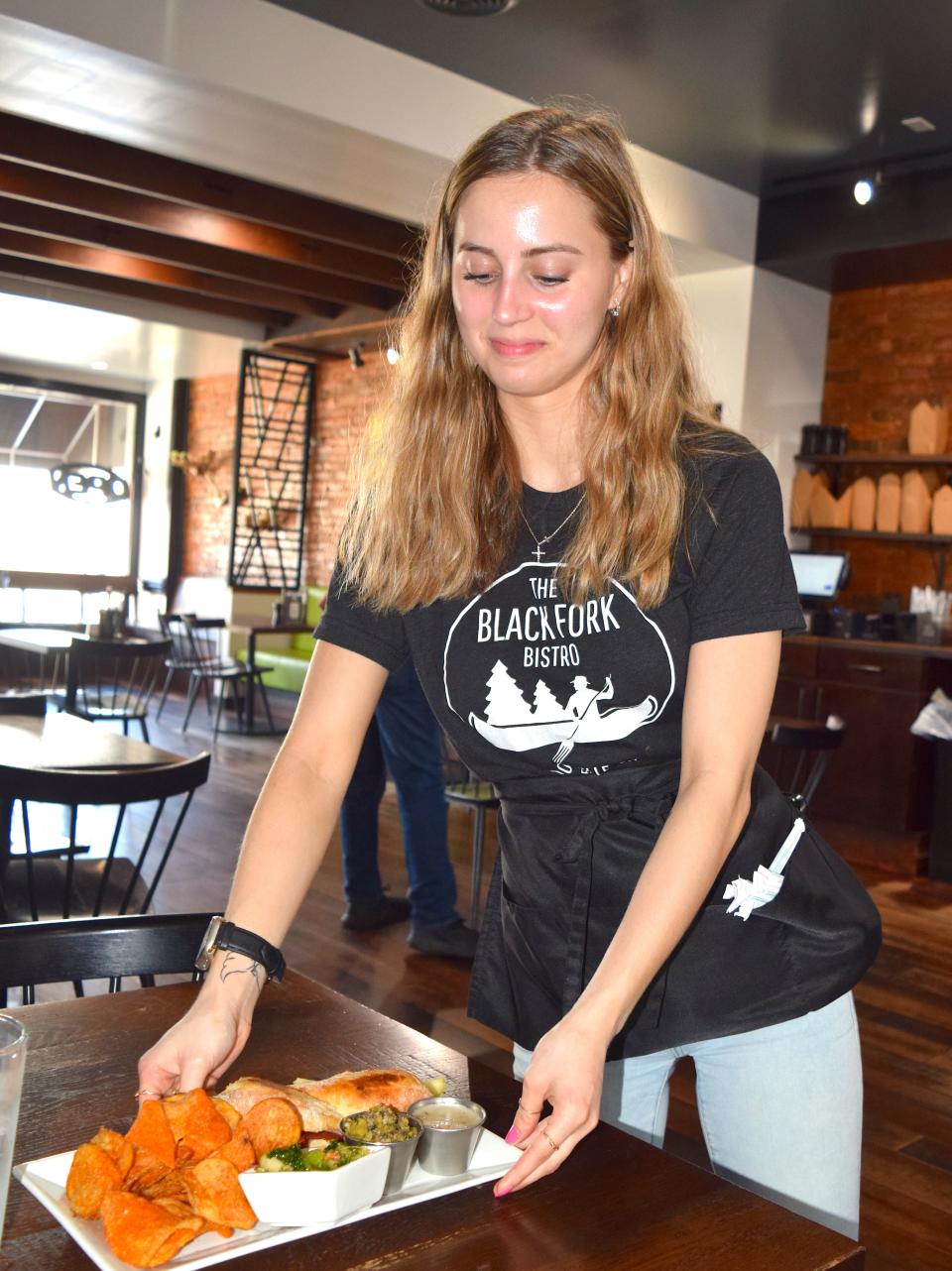 The Firetower burger is one of the more popular choices at Black Forest Bistro. It features onion straws, pepper jack cheese, jalapeno jam and fresh jalapeno and barbecue sauce on a brioche bun. Serenity Atwell serves up a meal at Black Fork.
