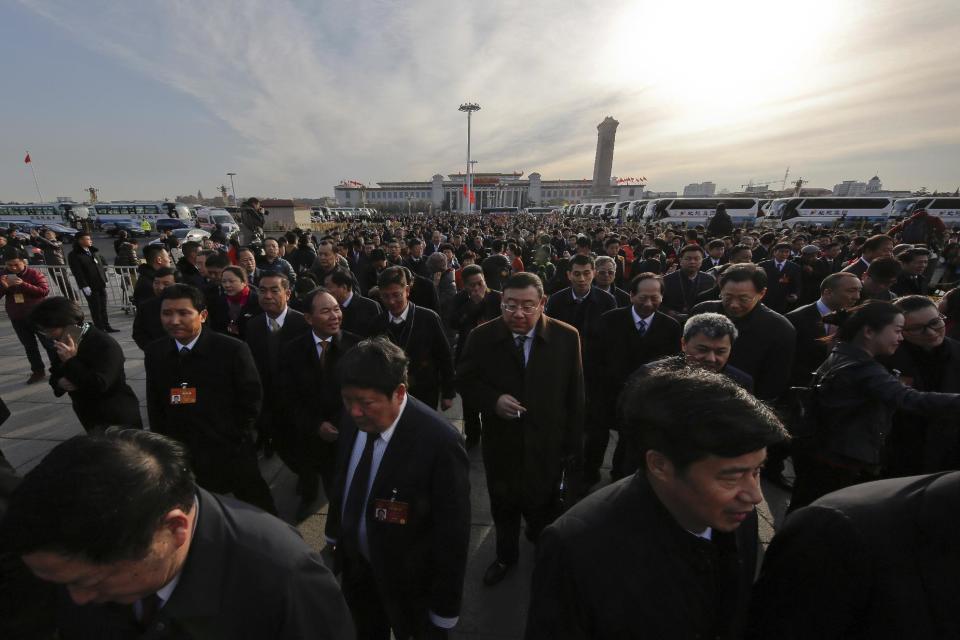 Delegates arrive at the Great Hall of the People to attend the opening session of the annual National People's Congress in Beijing, Sunday, March 5, 2017. China's top leadership as well as thousands of delegates from around the country are gathered at the Chinese capital for the annual legislature meetings. (AP Photo/Andy Wong)