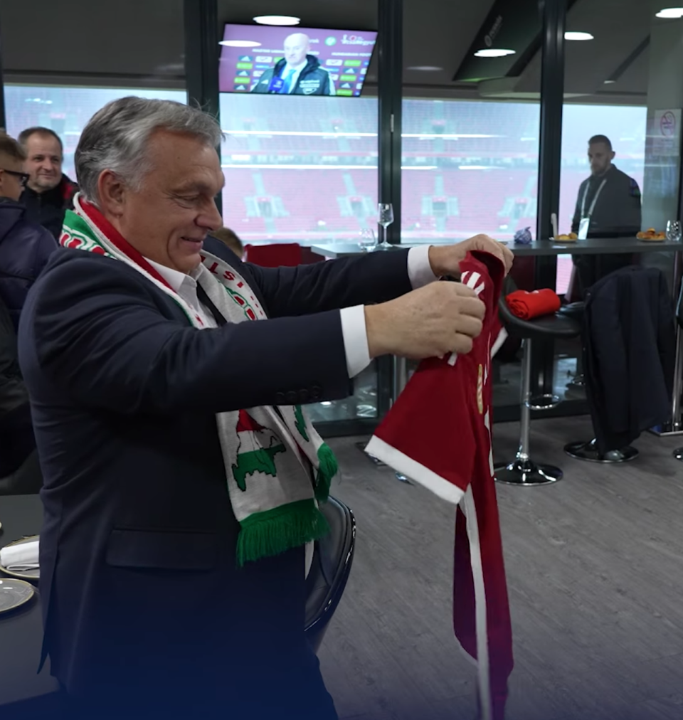 Viktor Orban is seen wearing a scarf allegedly depicting other nations’ territory as part of Hungary, in footage shared to his official Facebook page (screengrab)