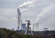 FILE - The coal-fired Uniper power plant Scholven steams behind a shut down coal mine in Gelsenkirchen, Germany, Friday, Nov. 5, 2021. It's not a summer heat wave that's making European leaders and businesses sweat. It's fear that Russia's manipulation of natural gas supplies will lead to an economic and political crisis next winter. Or, in the worst case, even sooner. (AP Photo/Martin Meissner, File)