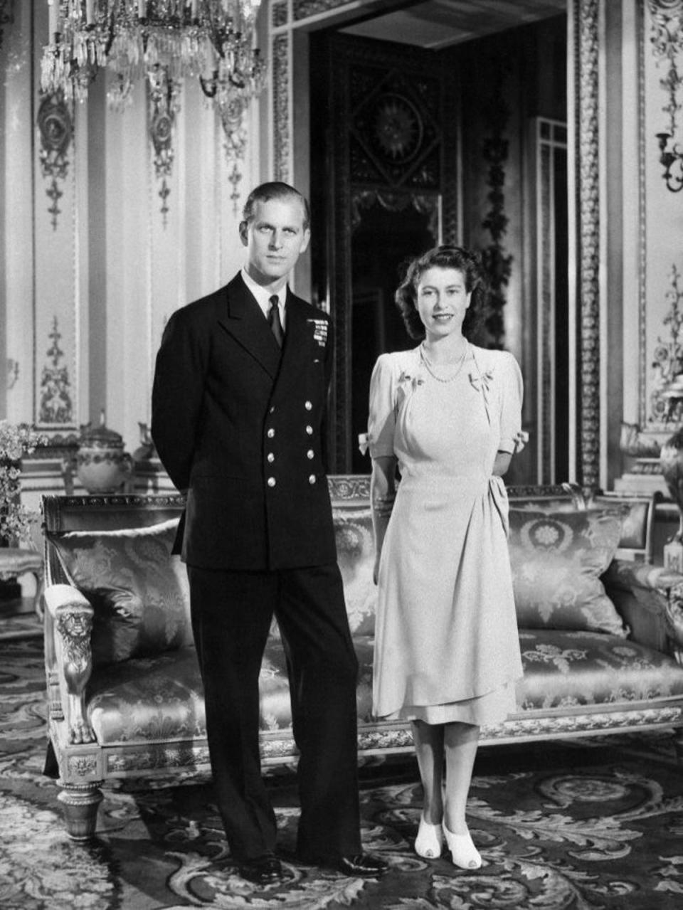 Queen Elizabeth II: The official announcement of Princess Elizabeth and Phillip Mountbatten's engagement. The pairing was incredibly controversial as Prince Phillip had no financial standing and he was foreign born, the prince of Denmark and Greece (though he served Britain in the war and was given British Citizenship), 1947 (Getty)