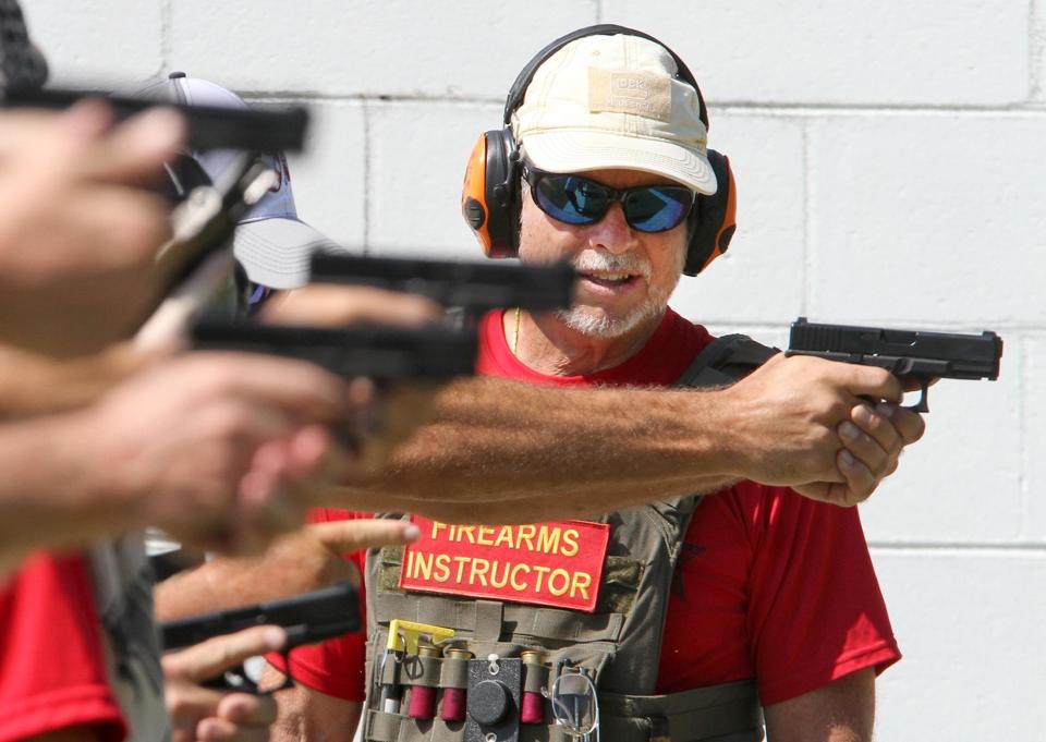 The Volusia County Sheriff's Office has worked closely with the school district's security team, including offering firearm training to its school guardians. In this photo from 2018, instructor Ron Waidelich watches trainees fire pistols.