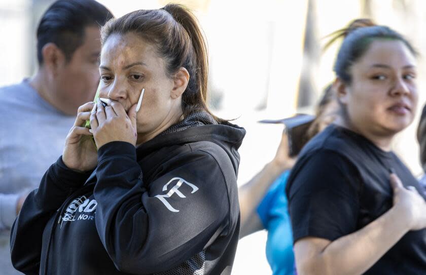 Van Nuys, CA - November 01: Parents wait for news after an altercation injuring several students and campus lockdown at Van Nuys High School on Wednesday, Nov. 1, 2023 in Van Nuys, CA. (Brian van der Brug / Los Angeles Times)