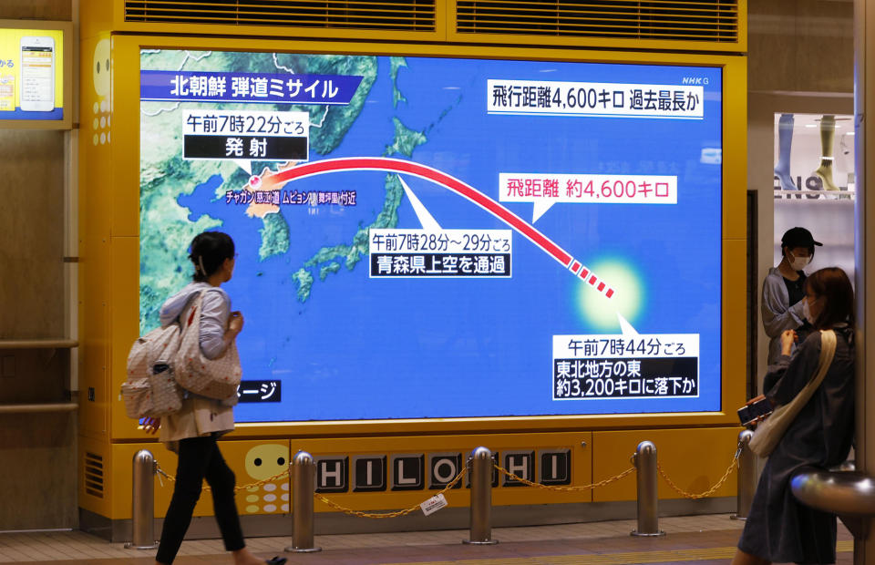 A huge monitor shows a North Korean ballistic missile flied over Japan, in Sapporo, Hokkaido, northern Japan on Oct. 4, 2022. (Kyodo News via AP)