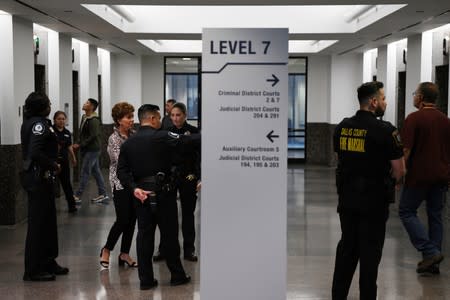 Police officers stand in the corridor on the first day of the trial against former police officer Amber Guyger in Dallas