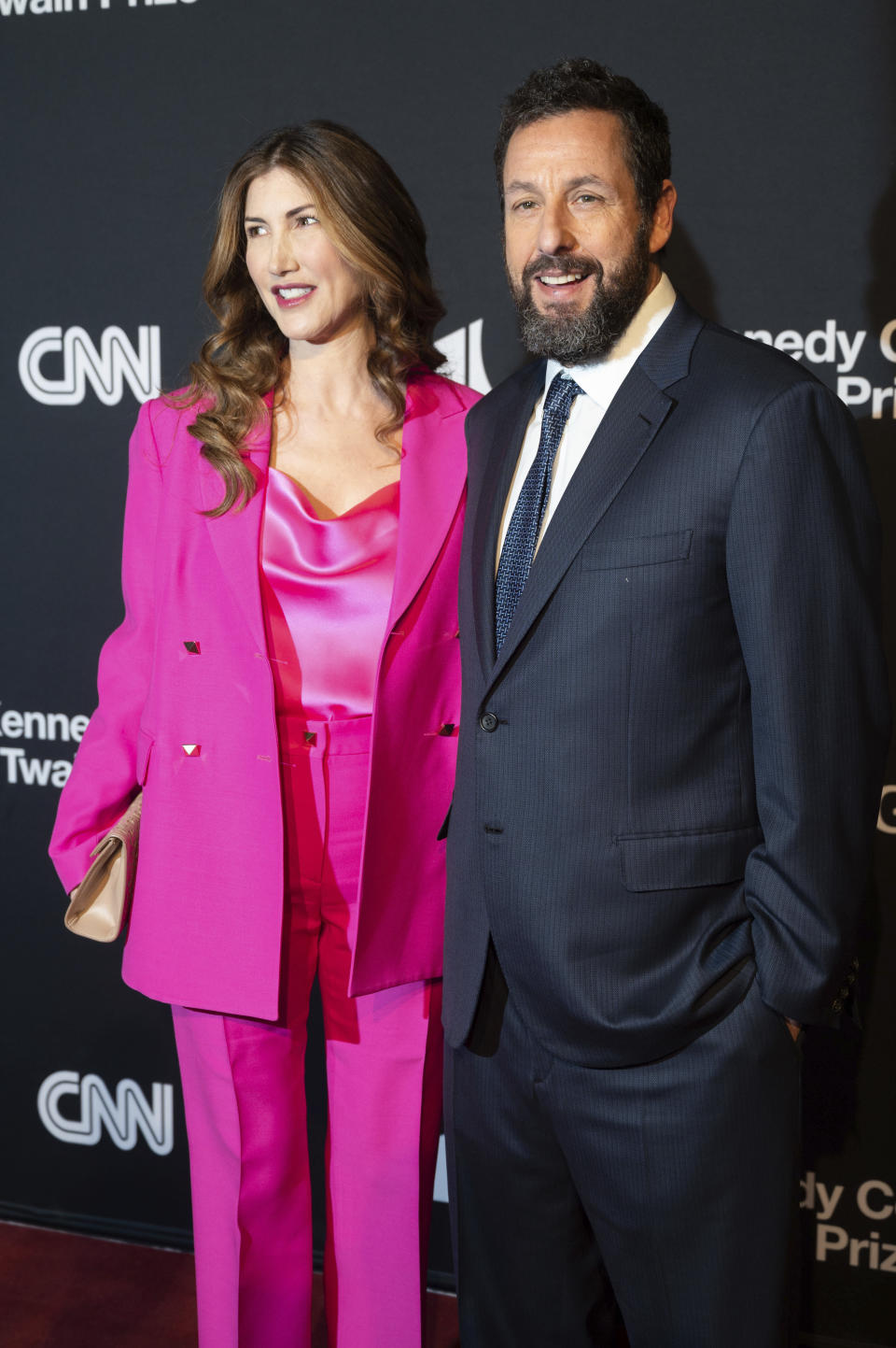 Mark Twain Prize recipient Adam Sandler, right, and his wife, Jackie Sandler arrive on the red carpet at the start of the 24th Annual Mark Twain Prize for American Humor at the Kennedy Center for the Performing Arts on Sunday, March 19, 2023, in Washington. (AP Photo/Kevin Wolf)