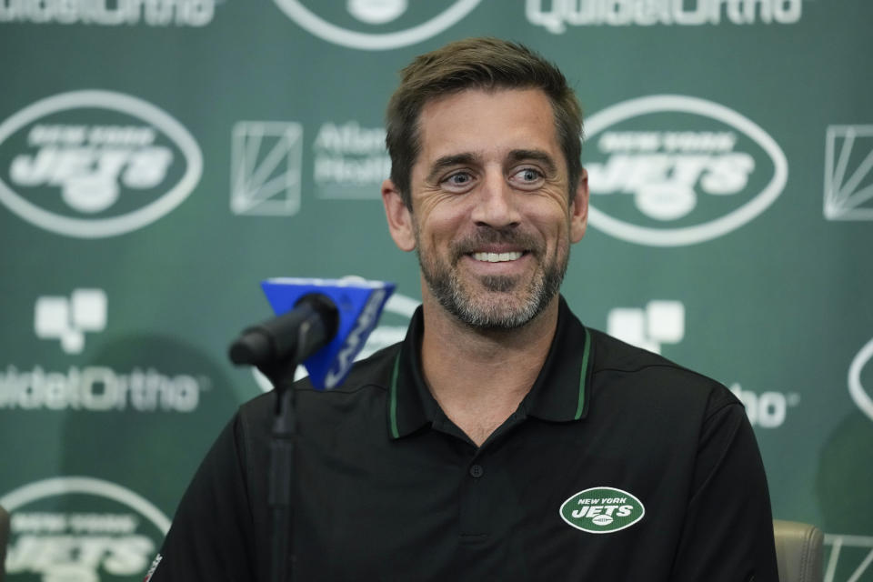 FILE - New York Jets' quarterback Aaron Rodgers smiles during an NFL football news conference at the Jets' training facility in Florham Park, N.J., Wednesday, April 26, 2023. The Super Bowl champion Kansas City Chiefs will host the Detroit Lions on Sept. 7 to kick off the 2023 NFL season. And NFL fans will get their first look at star quarterback Aaron Rodgers in a Jets uniform when New York faces the Buffalo Bills on “Monday Night Football” on Sept. 11. That's according to early details released Thursday, May 11, 2023, on this year’s NFL schedule. (AP Photo/Seth Wenig, File)