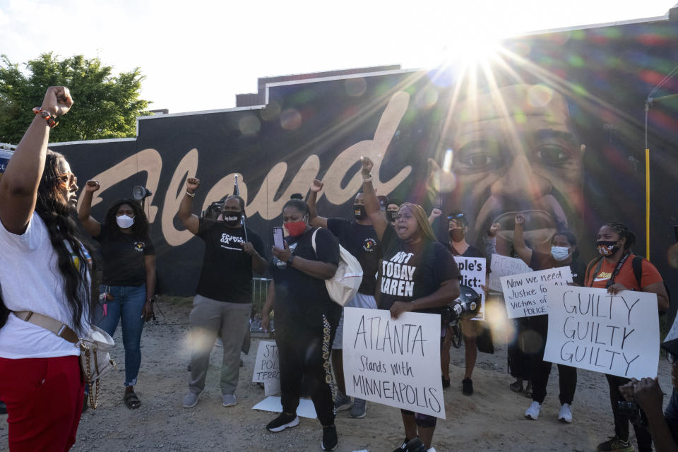 People gather before a march in Atlanta, Tuesday, April 20, 2021, after former Minneapolis police Officer Derek Chauvin was found guilty on all counts in the death of George Floyd. (AP Photo/Ben Gray)