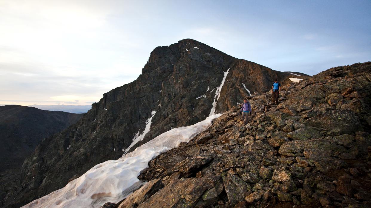  Hikers descent Mount of the Holy Cross. 