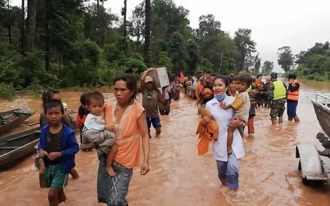 A still from a video posted by Attapeu Today's Facebook page showing people evacuating flooded villages after a Laos dam collapse - Credit: Attapeu Today