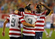 TAMPA, FL - JUNE 08: Forward Herculez Gomez #9 of Team USA celebrates his goal with Carlos Bocanegra #3 and Maurice Edu #7 against Team Antigua and Barbuda during the FIFA World Cup Qualifier Match at Raymond James Stadium on June 8, 2012 in Tampa, Florida. (Photo by J. Meric/Getty Images)