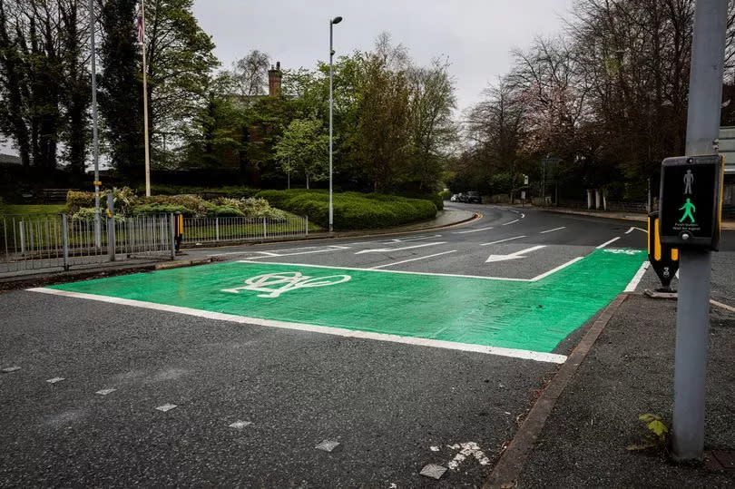 The shiny new cycle zone installed at the junction of Church Lane and Bury New Road. But 20 potholes and cracks ten yards away have not been repaired and are not included in works scheduled for the next 12 months.