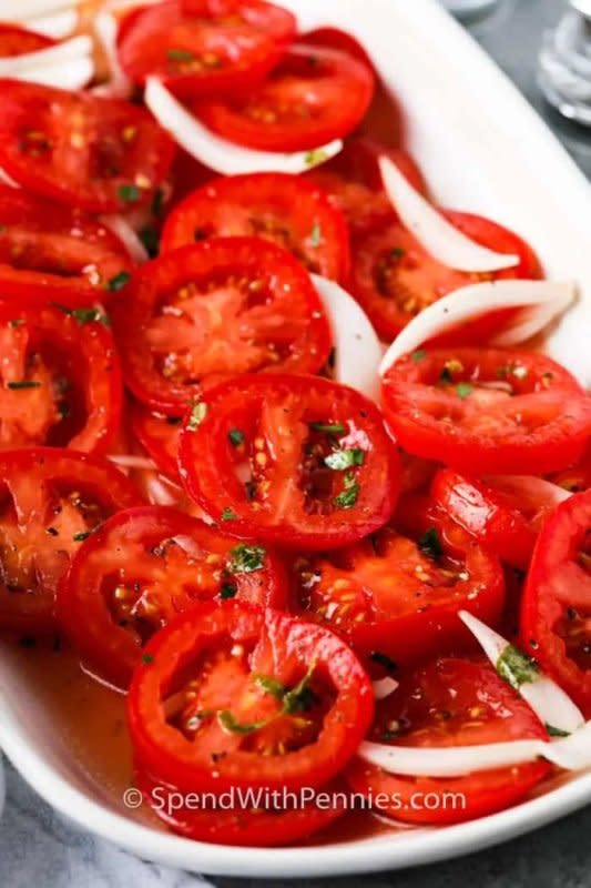 <p>Spend With Pennies</p><p>Pick the tomatoes fresh from the garden for the most flavor in this dish.</p><p><strong>Get the recipe: <a href="https://www.spendwithpennies.com/marinated-tomatoes/" rel="nofollow noopener" target="_blank" data-ylk="slk:Marinated Tomatoes;elm:context_link;itc:0;sec:content-canvas" class="link rapid-noclick-resp">Marinated Tomatoes</a></strong></p><p><strong>Related: <a href="https://parade.com/1046242/kristamarshall/best-summer-tomato-recipes/" rel="nofollow noopener" target="_blank" data-ylk="slk:25 Tasty Tomato Recipes For Summer;elm:context_link;itc:0;sec:content-canvas" class="link rapid-noclick-resp">25 Tasty Tomato Recipes For Summer</a></strong></p>