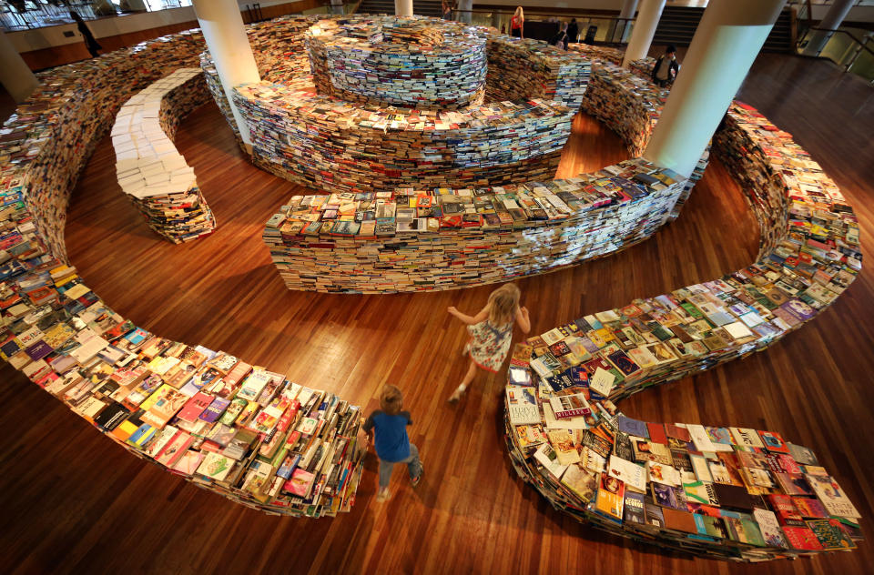 Children play in the 'aMAZEme' labyrinth made from books at The Southbank Centre on July 31, 2012 in London, England. (Photo by Peter Macdiarmid/Getty Images)