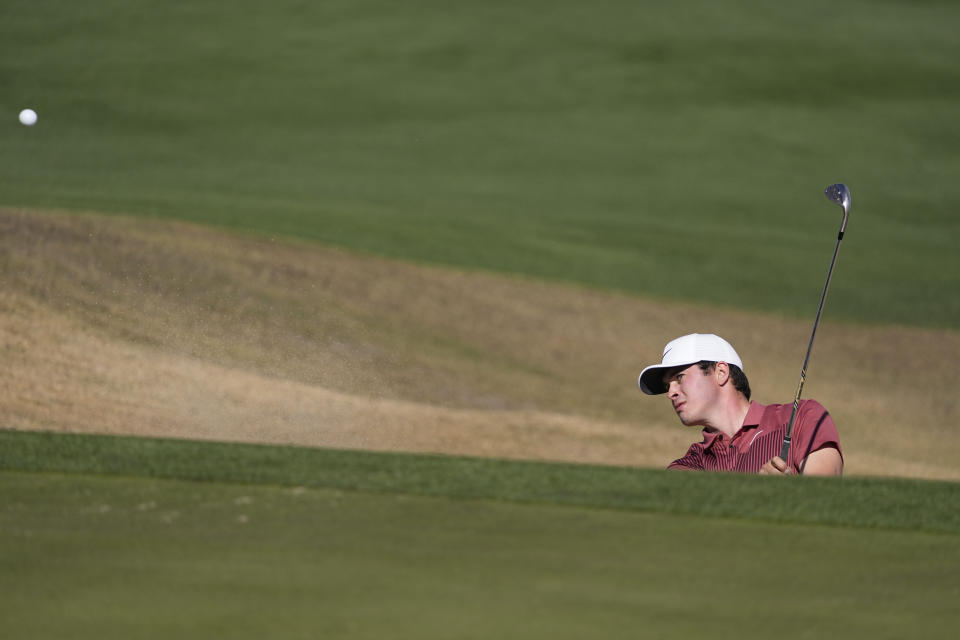 Davis Thompson to the eighth green during the final round of the American Express golf tournament on the Pete Dye Stadium Course at PGA West Sunday, Jan. 22, 2023, in La Quinta, Calif. (AP Photo/Mark J. Terrill)