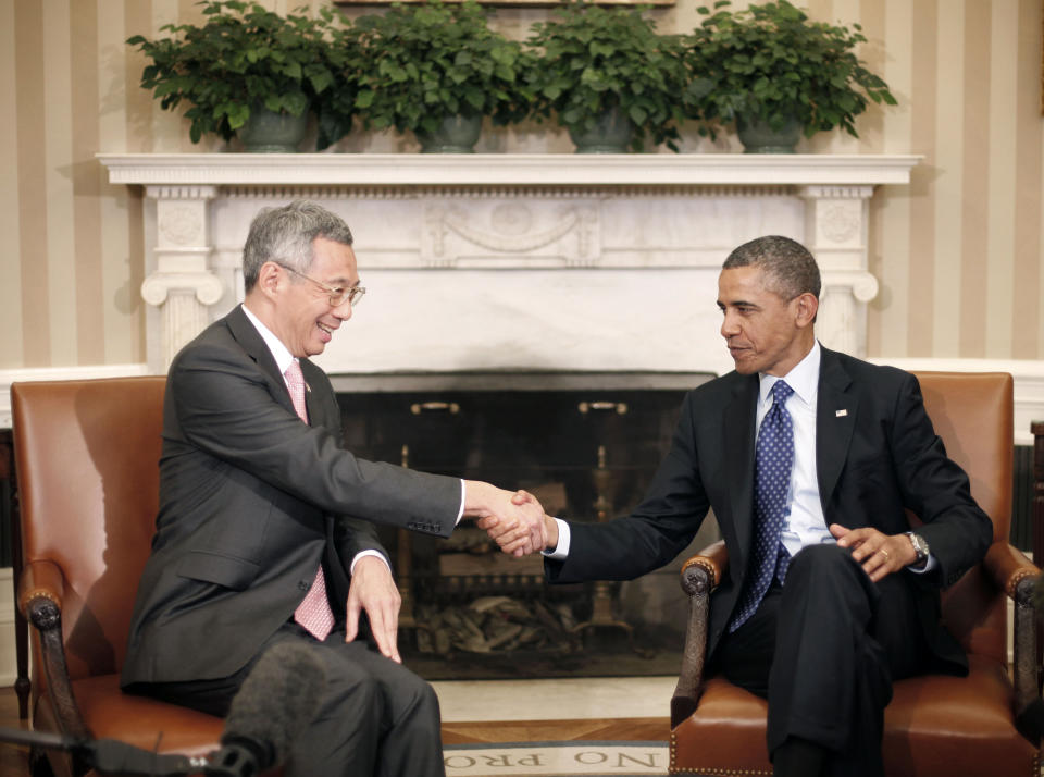 President Barack Obama shakes hands with with Singapore Prime Minister Lee Hsien Loong during their meeting in the Oval Office of the White House in Washington, Tuesday, April, 2, 2013. (AP Photo/Pablo Martinez Monsivais)