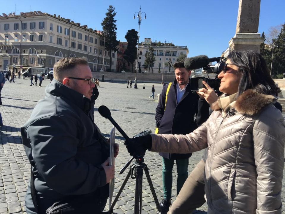 Gemma Hickey speaks with a reporter in Rome, Italy, where they went to lobby for the release of the names of clergy credibly accused of abuse.