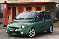 <p>The original Multipla, a six-seater version of <strong>Fiat</strong>'s tiny <strong>600</strong>, looked thoroughly bizarre. The modern equivalent introduced in 1998 did too, though it had the advantages of a more sociable seating arrangement (two rows of three seats) and a front-end <strong>crumple zone</strong> which the 1950s car entirely lacked.</p><p>The design was controversial, to say the least. Fiat stuck to its guns for a few years, but backed off in 2004, <strong>restyling</strong> the car to make it appear far more conventional, and frankly less memorable.</p>