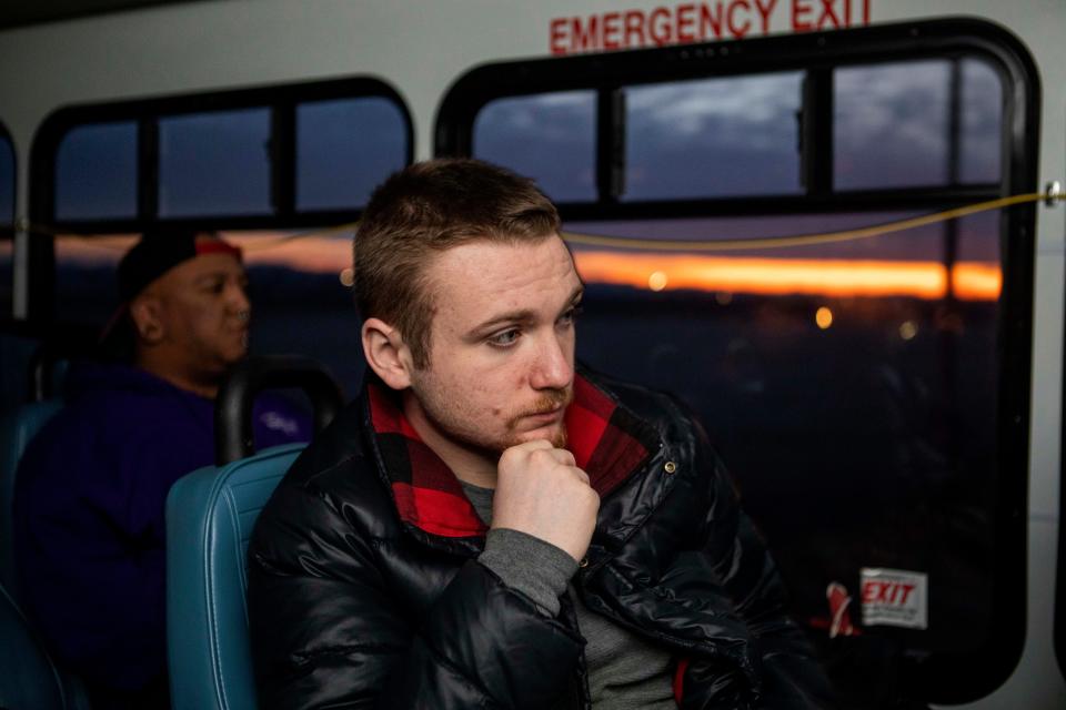 Devin Parsely (right) and Donnie Turner, both of Chillicothe, rides the bus on his way to work at PGW Auto Glass on Dec. 20, 2022 in Chillicothe, Ohio. The Chillicothe Transit System provides free transportation for local passengers in need of transportation around the Chillicothe area.