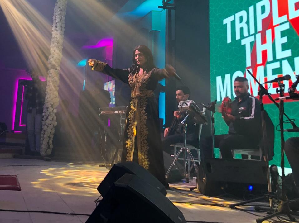 Iraqi singer Sajda Obeid gives a concert at the "Yarmouk Club" in Baghdad, Iraq, Monday, Dec. 13, 2021. Obeid is a unifying figure in Iraq's fractured society. For older Iraqis, the 63-year old is a symbol of a bygone golden era. To the young, her upbeat love songs and subtly racy lyrics have become a channel for self-expression in a largely conservative society. (AP Photo/Samya Kullab)