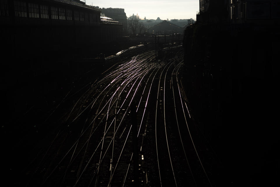 Railways are pictured outside the Saint Lazare train station, Tuesday, Dec. 31, 2019 in Paris. The strikes over the French government's plan to revamp the retirement system have disrupted transport across France and beyond, hobbling Paris Metros and trains across the country as well as businesses. The strikes have been especially felt over the holiday season. (AP Photo/Kamil Zihnioglu)