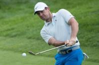 Jun 21, 2018; Cromwell, CT, USA; Rory McIlroy chips onto the 18th green during the first round of the Travelers Championship at TPC River Highlands. Mandatory Credit: Bill Streicher-USA TODAY Sports