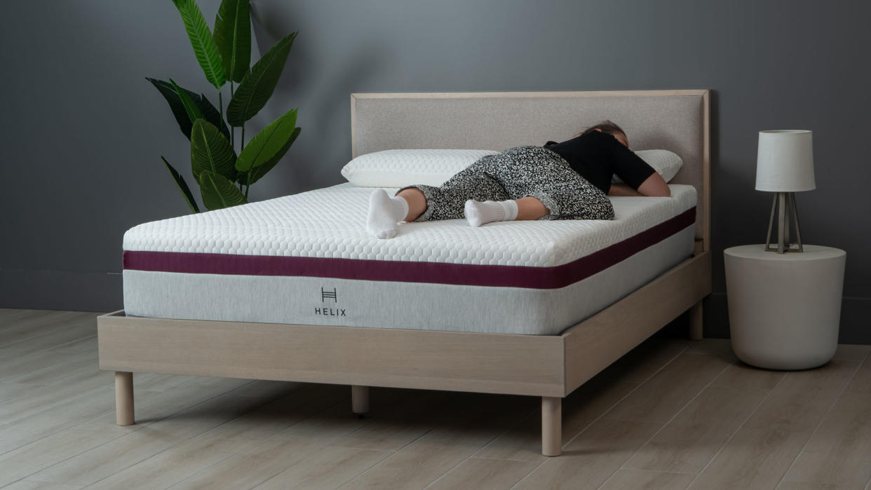 Helix Dusk mattress, with Sleep Editor lying on her front on it 