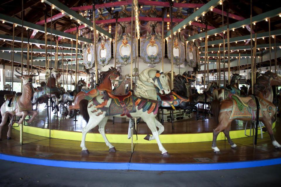 This June 19, 2013 photo provided by the NYC Landmarks Preservation Commission shows the 1910 Forest Park Carousel in the Queens borough of New York. The carousel, featuring 46 hand-carved horses, a lion, tiger and deer, is the city's first carousel to get the designation from Landmarks Preservation Commission. (AP Photo/NYC Landmarks Preservation Commission, Christopher D. Brazee)