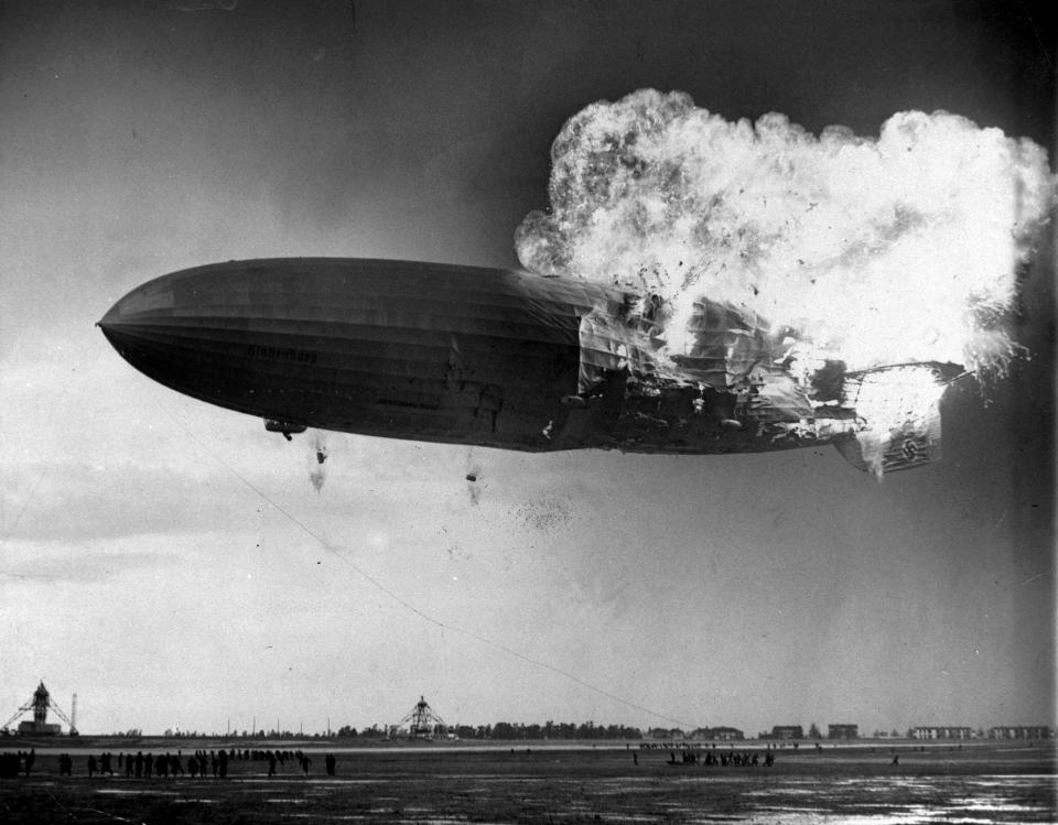 <p>The German zeppelin Hindenburg bursts into flames as it noses toward the mooring post at the Naval Air Station in Lakehurst, N.J. on May 6, 1937. Thirty-five people on board and one ground crew member were killed. (AP Photo/Murray Becker) </p>