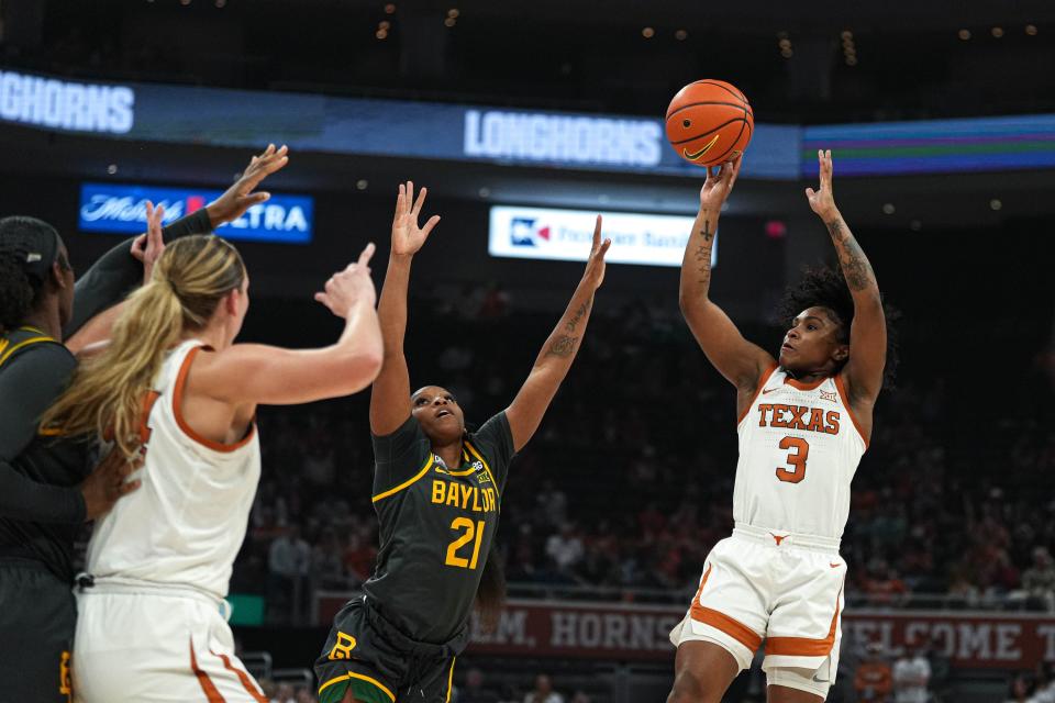 Texas guard Rori Harmon shoots over a Baylor defender. Harmon was last season's Big 12 defensive player of the year and is this season's Big 12 preseason player of the year. "I feel like I have very high expectations for myself," she said.