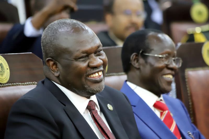 South Sudan's First Vice President Riek Machar and Second Vice President James Wani Igga, attend their swearing-in ceremony at the State House in Juba