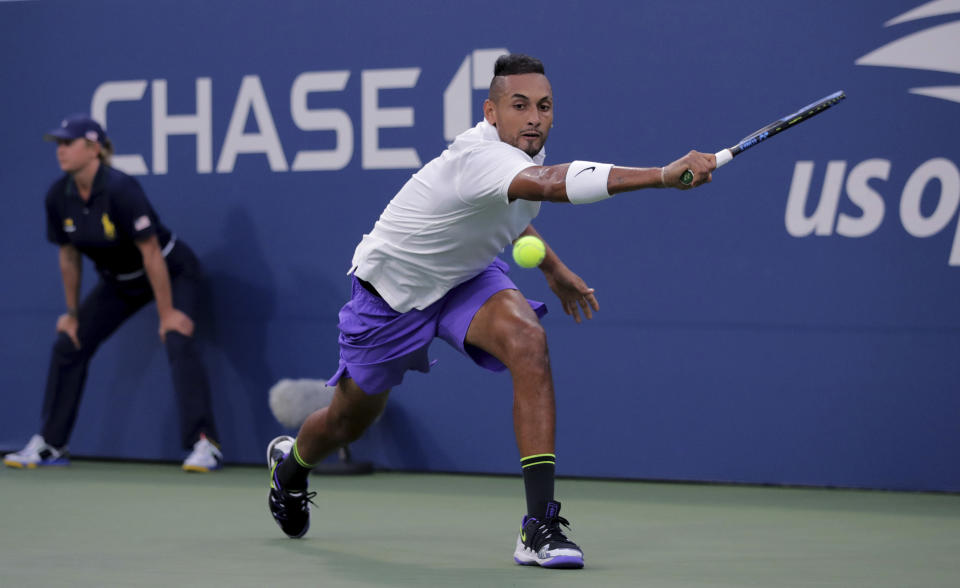 Nick Kyrgios, of Australia, returns a shot to Antoine Hoang, of France, during the second round of the US Open tennis championships Thursday, Aug. 29, 2019, in New York. (AP Photo/Charles Krupa)