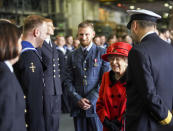 Britain's Queen Elizabeth II visits the HMS Queen Elizabeth at HM Naval Base, ahead of the ship's maiden deployment, in Portsmouth, England, Saturday May 22, 2021. HMS Queen Elizabeth will be leading a 28-week deployment to the Far East that Prime Minister Boris Johnson has insisted is not confrontational towards China. (Steve Parsons/Pool Photo via AP)