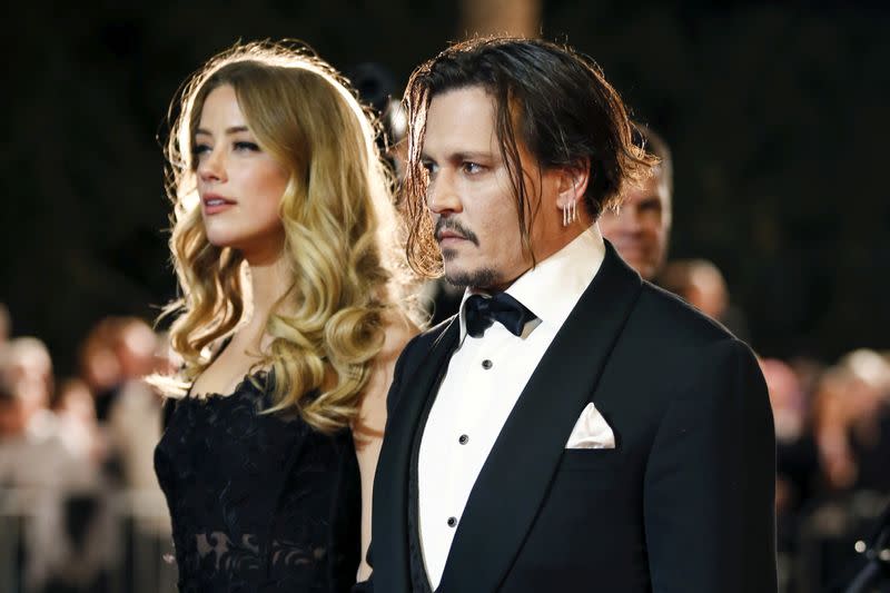 FILE PHOTO: Desert Palm Achievement Award recipient actor Johnny Depp and wife actress Amber Heard pose at the 27th Annual Palm Springs International Film Festival Awards Gala in Palm Springs