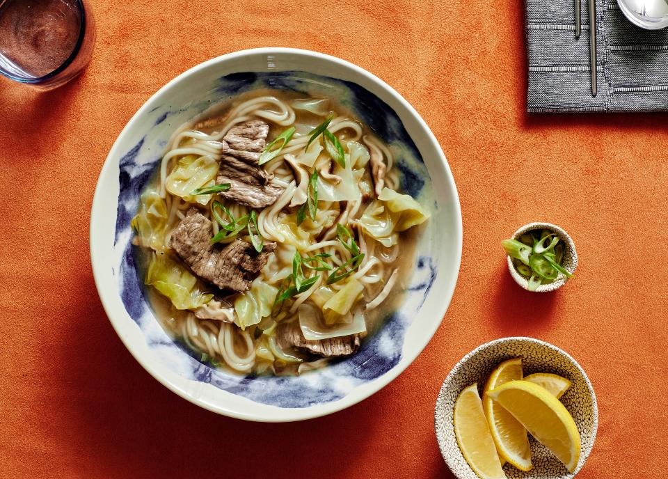 Instant dashi and shaved beef provide both ease and deep flavor in this weeknight dinner idea, a spin on Japanese-style <a href="https://www.bonappetit.com/story/how-to-hot-pot?mbid=synd_yahoo_rss" rel="nofollow noopener" target="_blank" data-ylk="slk:hot pot;elm:context_link;itc:0;sec:content-canvas" class="link ">hot pot</a>. <a href="https://www.bonappetit.com/recipe/shabu-shabu-noodle-soup?mbid=synd_yahoo_rss" rel="nofollow noopener" target="_blank" data-ylk="slk:See recipe.;elm:context_link;itc:0;sec:content-canvas" class="link ">See recipe.</a>
