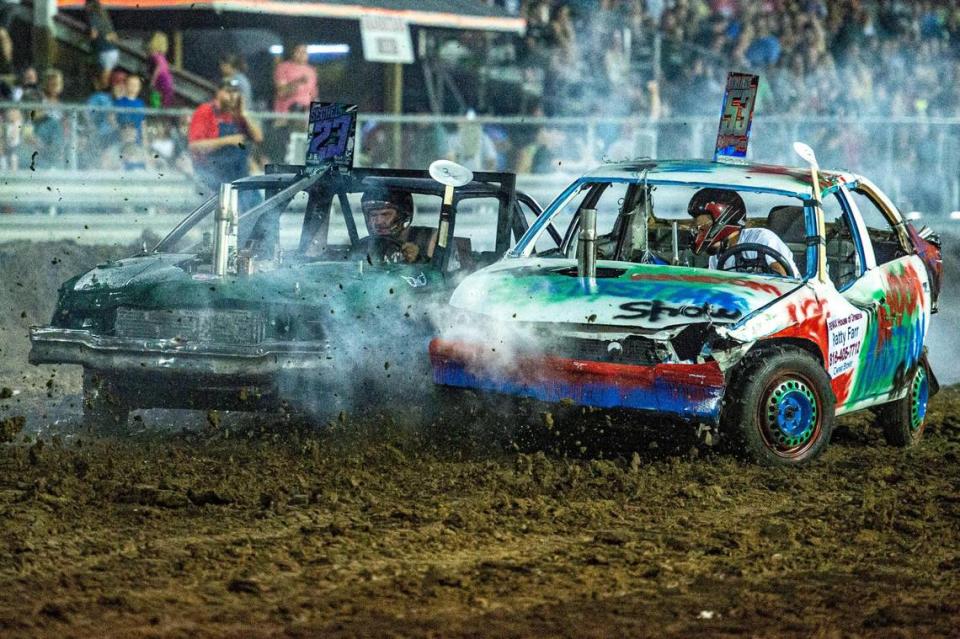 Kelby Dean runs into Jeremy Seckel in the third heat of the compact car category at the demolition derby at the Platte County Fair, Thursday, July 22, 2021, in Tracy, Missouri.