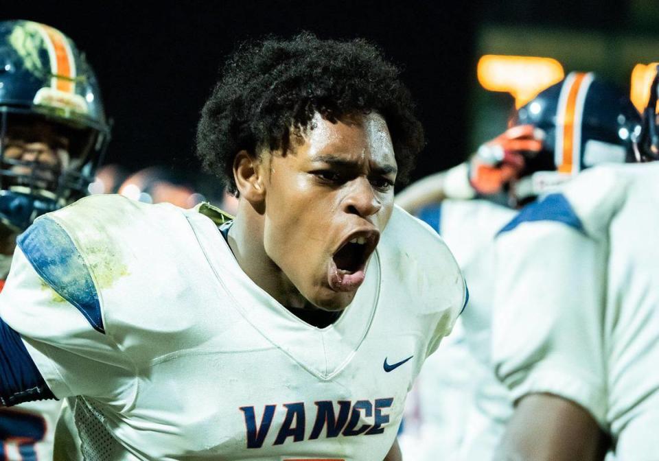 Vance Cougar quarterback Austin Grier (center) celebrates a Cougar touchdown. Vance would defeat Richmond 38-7.