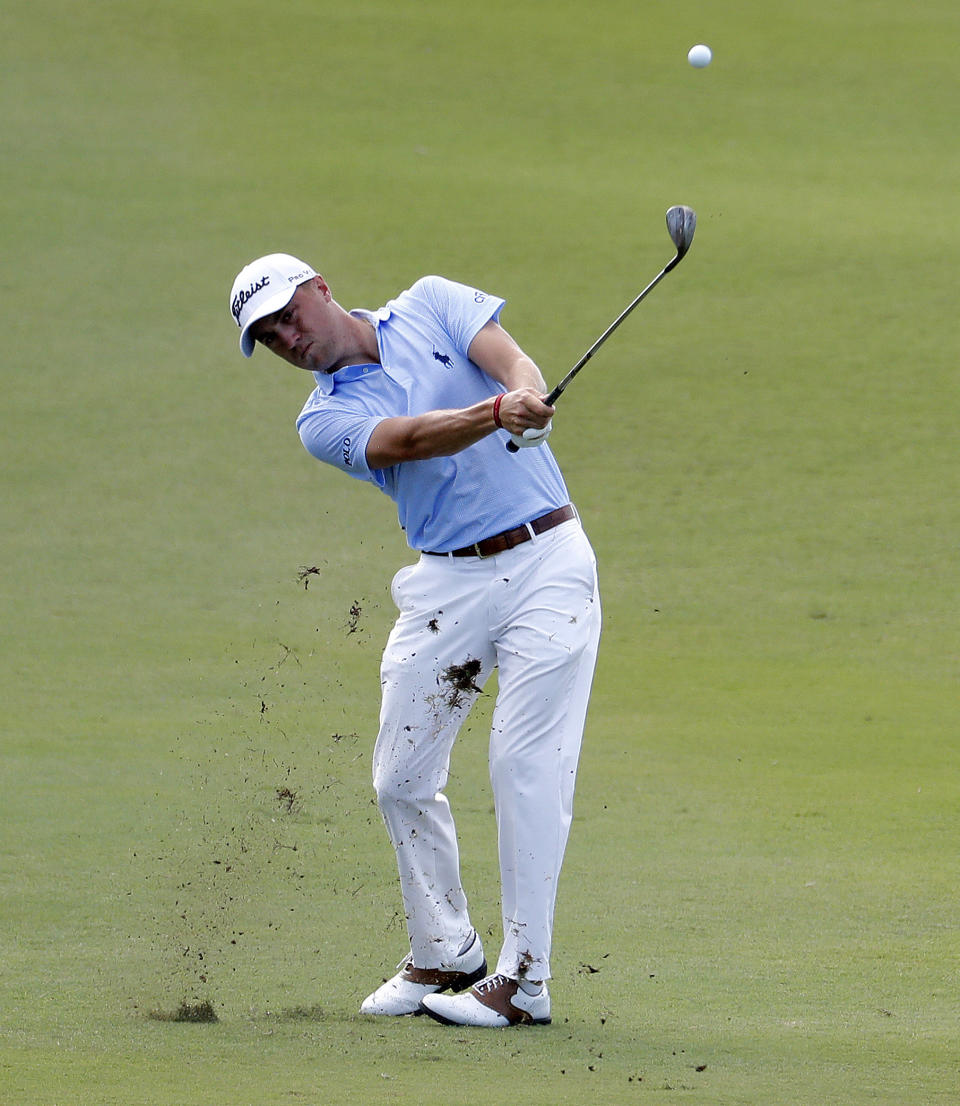 Justin Thomas hits his second shot on the 13th fairway during the final round of the Tournament of Champions golf event, Sunday, Jan. 6, 2019, at Kapalua Plantation Course in Kapalua, Hawaii. (AP Photo/Matt York)