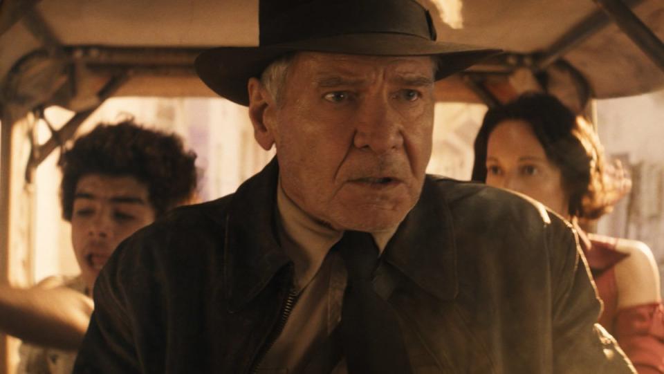 Indiana Jones in a vehicle in the Dial of Destiny