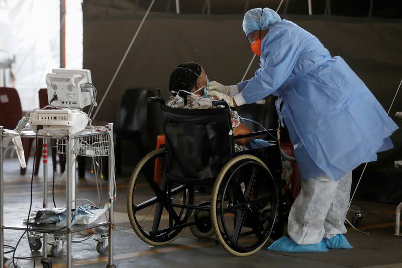 FILE PHOTO: A healthcare worker tends to a coronavirus patient at Steve Biko Academic Hospital in Pretoria