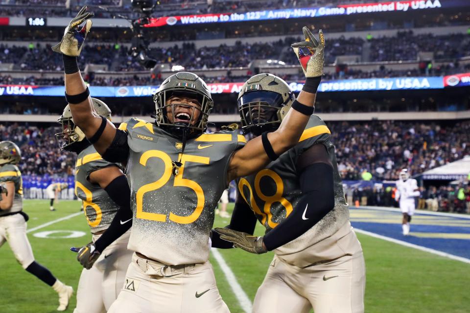 Army players celebrate after the team blocked a punt return by Navy for a touchdown in the second quarter of an NCAA college football game in Philadelphia, Saturday, Dec. 10, 2022. (Heather Khalifa/The Philadelphia Inquirer via AP)